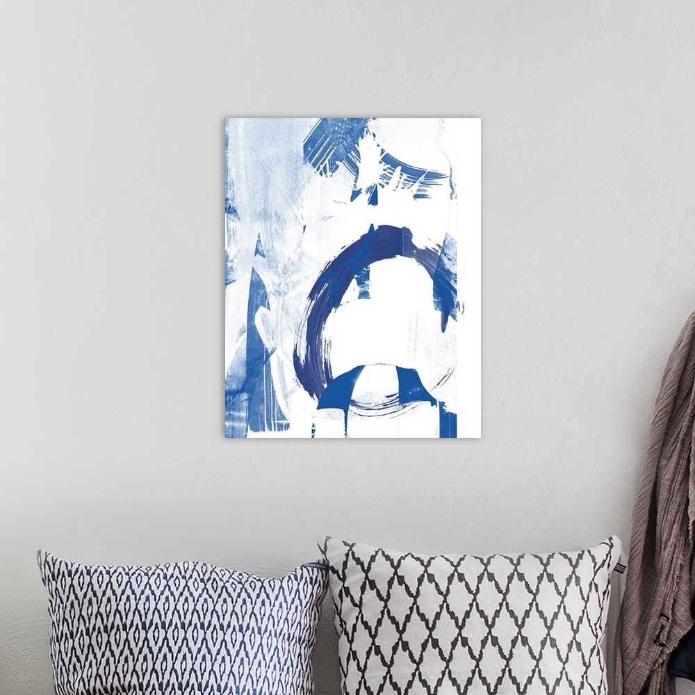 A bohemian room featuring Contemporary abstract artwork in contrasting deep blue and stark white.