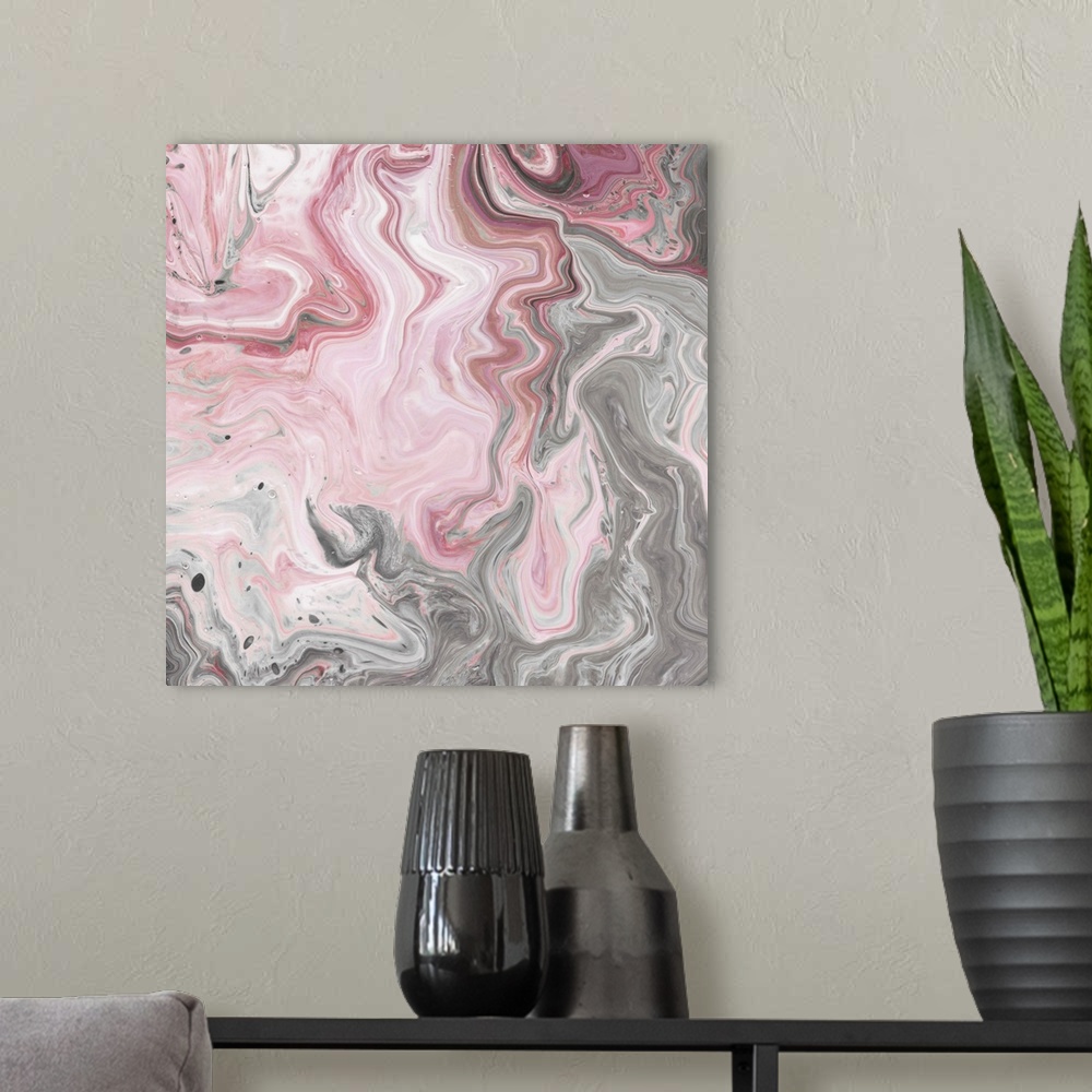 A modern room featuring Square abstract decor with marbling colors of pink, gray, and white.