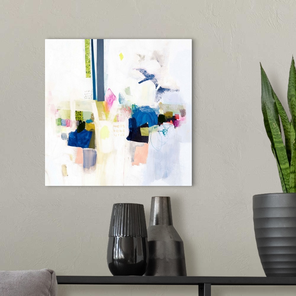 A modern room featuring Contemporary abstract painting in bright hues on a neutral background.