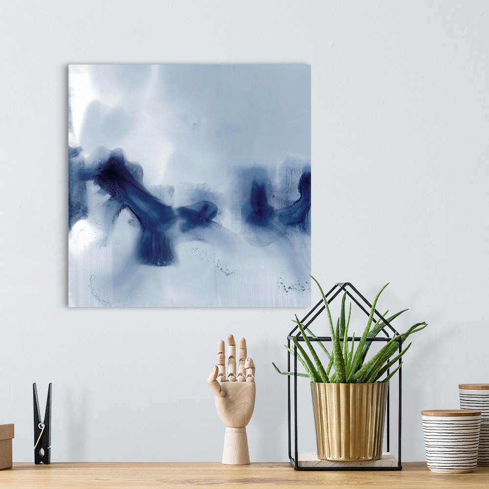 A bohemian room featuring Contemporary abstract painting in inky blue hues.