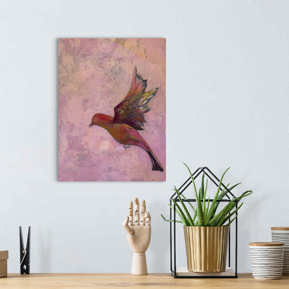 A bohemian room featuring Colorful contemporary painting of a bird in flight against a pink background.