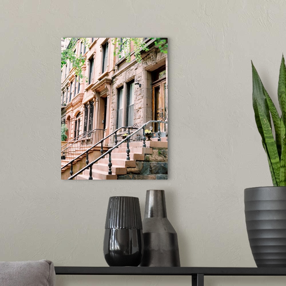A modern room featuring Photograph of brick and cement steps leading up to an iconic Brownstone house in New York.