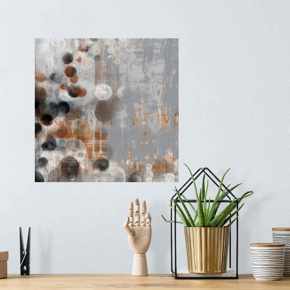 A bohemian room featuring Abstract artwork of washed out colors and circle shapes.