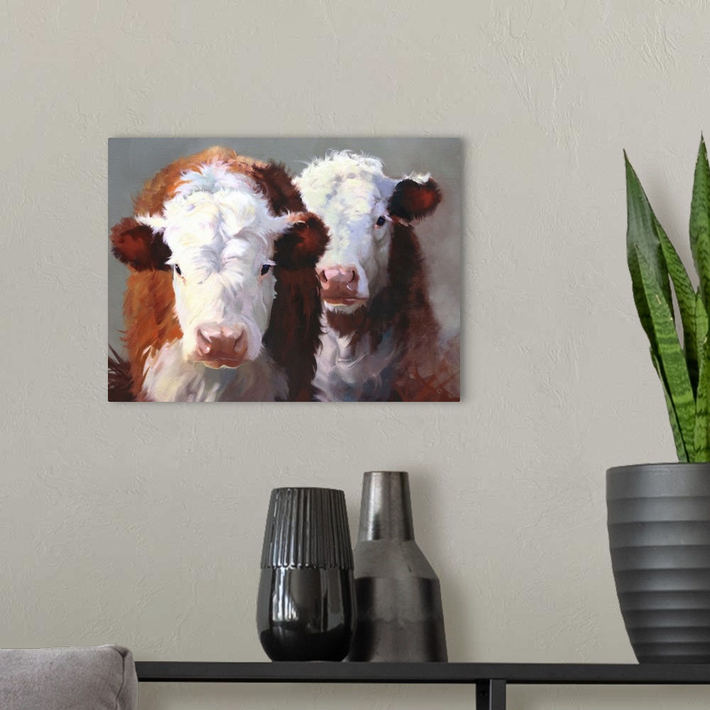 A modern room featuring Contemporary painting of two brown and white cows standing closely together.