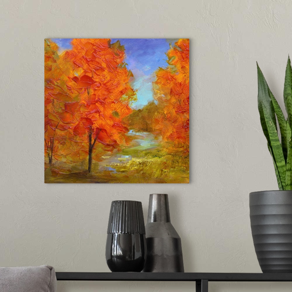 A modern room featuring Contemporary artwork of a grove of trees with bright orange leaves.