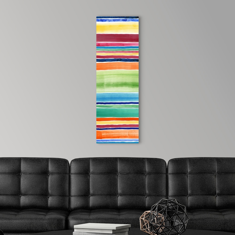 A modern room featuring Abstract art print of horizontal stripes in tropical rainbow colors.