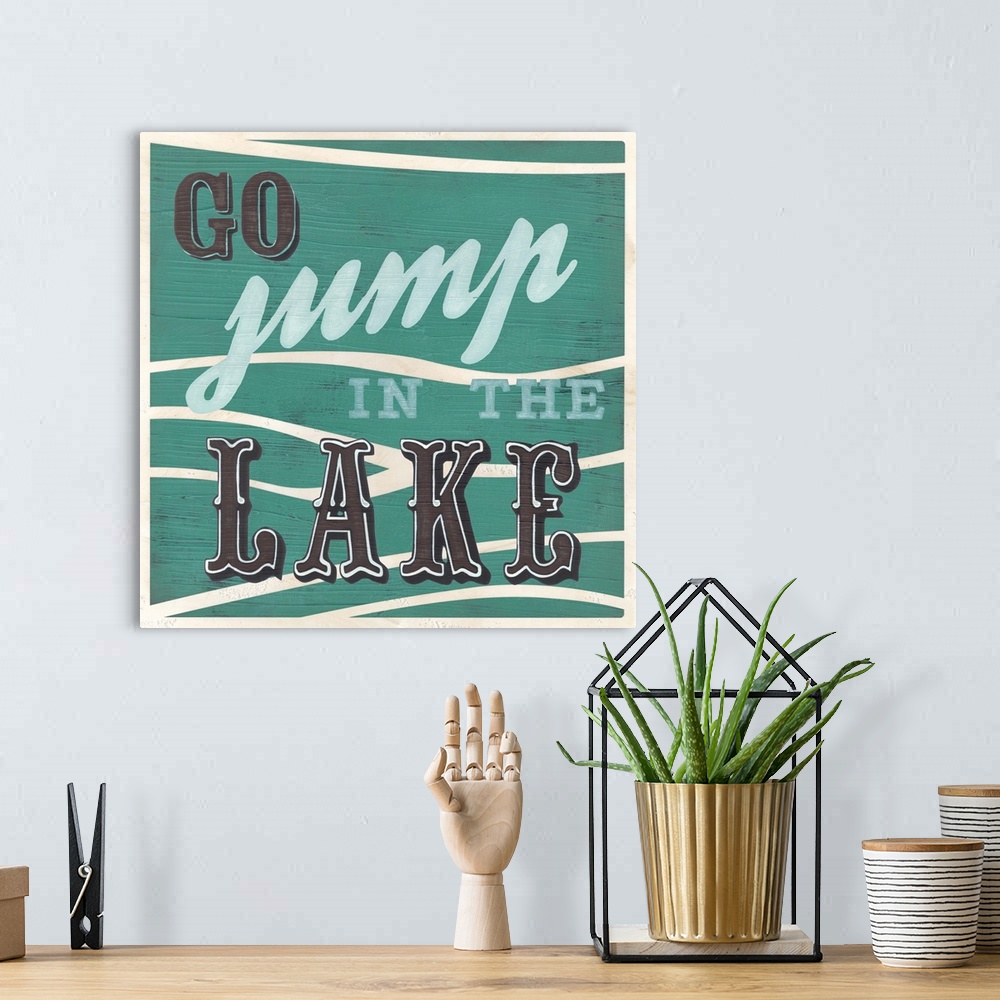 A bohemian room featuring Decorative sign for a cabin or lodge that reads "Go Jump In The Lake."