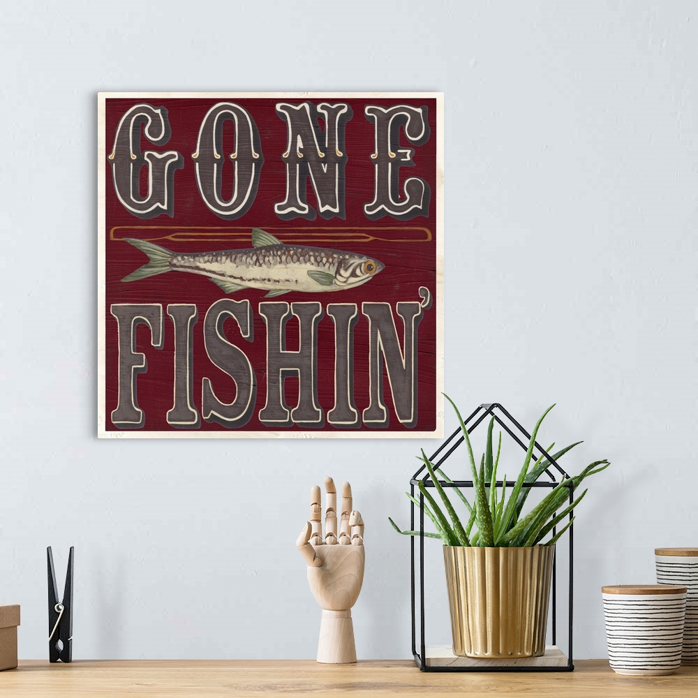 A bohemian room featuring Decorative sign for a cabin or lodge that reads "Gone Fishin'."