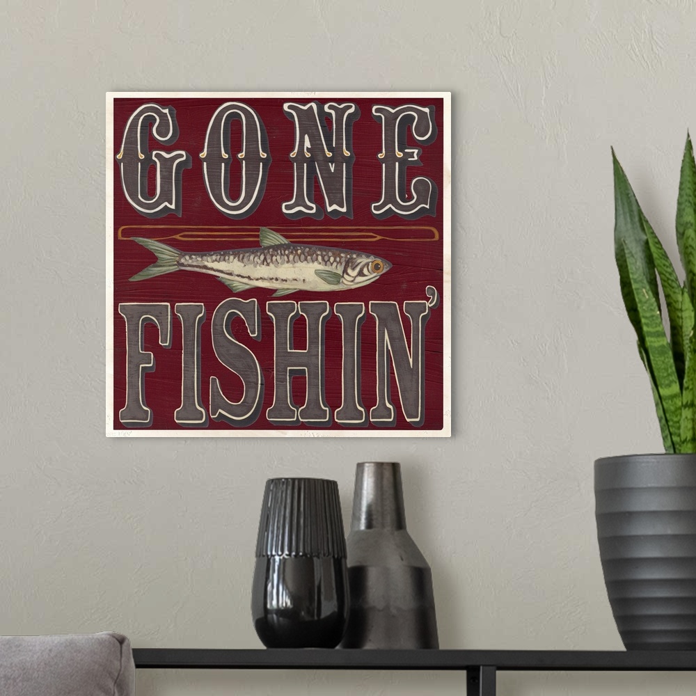 A modern room featuring Decorative sign for a cabin or lodge that reads "Gone Fishin'."
