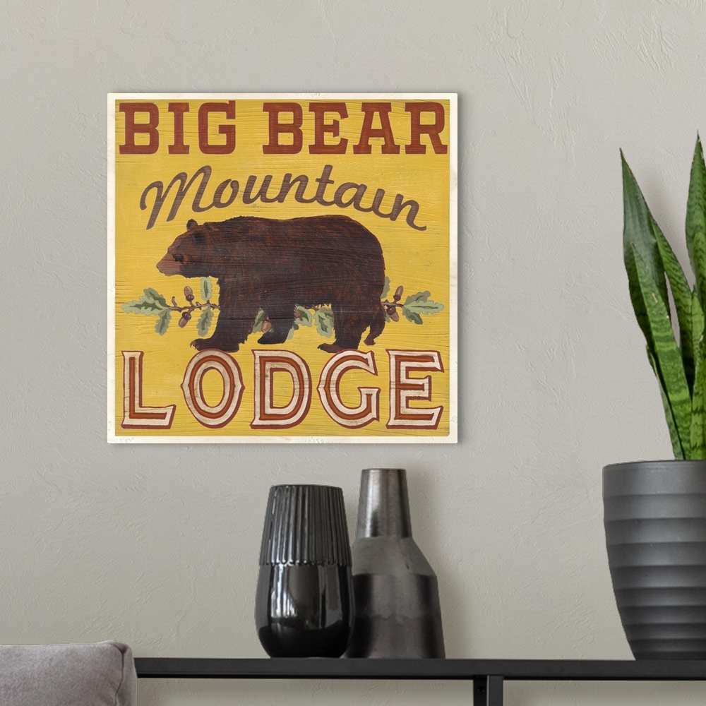 A modern room featuring Decorative sign for a cabin or lodge that reads "Big Bear Mountain Lodge."