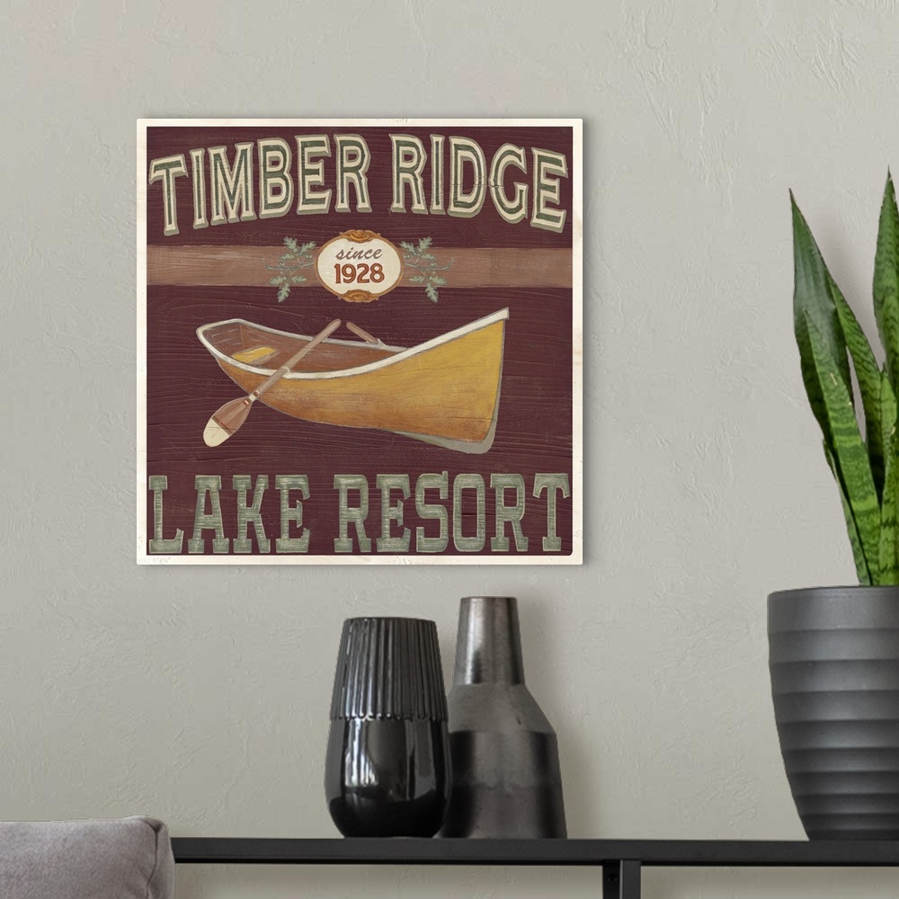 A modern room featuring Decorative sign for a cabin or lodge that reads "Timber Ridge Lake Resort."