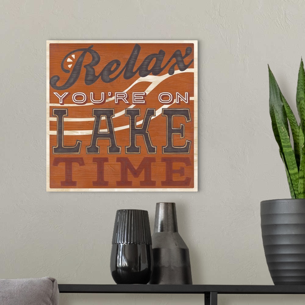 A modern room featuring Decorative sign for a cabin or lodge that reads "Relax, You're On Lake Time."