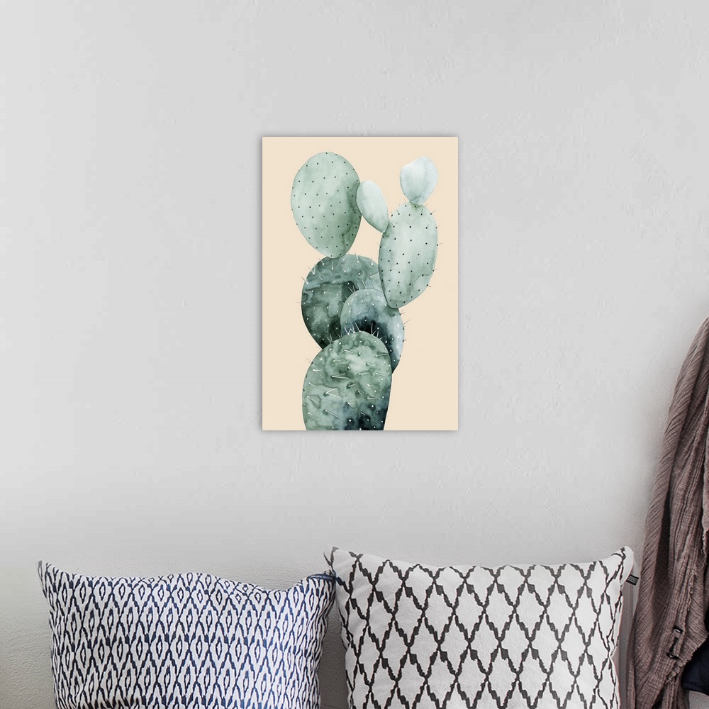 A bohemian room featuring Watercolor painting of a cactus on a pale coral background.