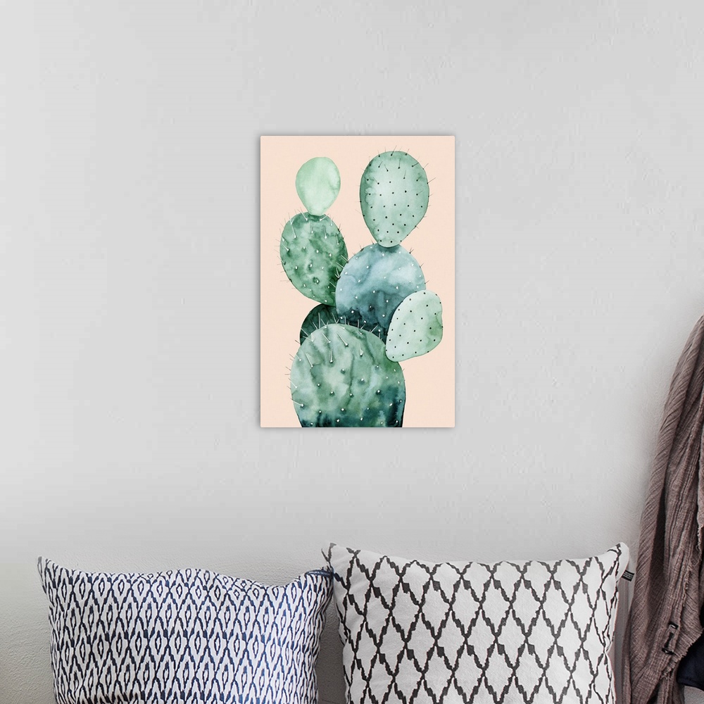 A bohemian room featuring Watercolor painting of a cactus on a pale coral background.