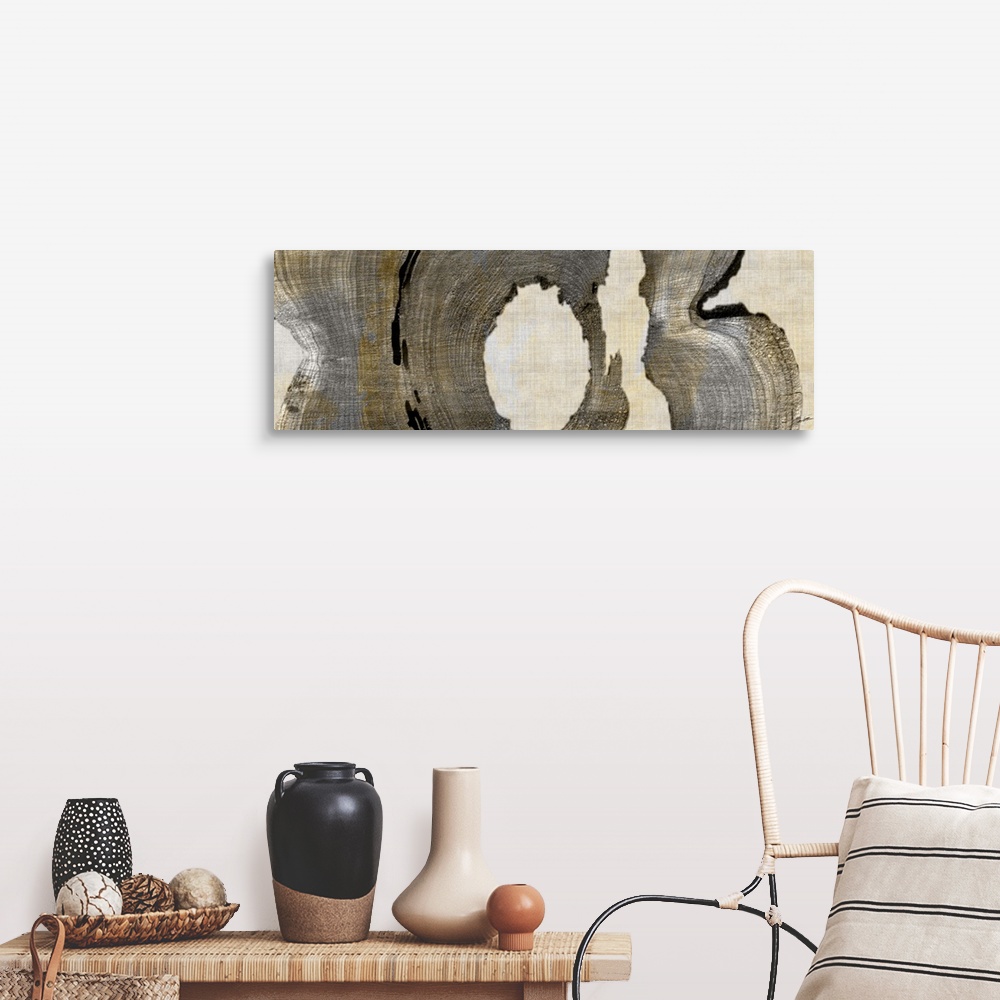 A farmhouse room featuring Abstract artwork in brown shades made from cross sections of tree trunks.