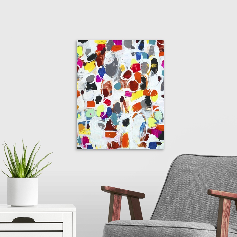 A modern room featuring Contemporary abstract painting using wild colors and little organic shapes.