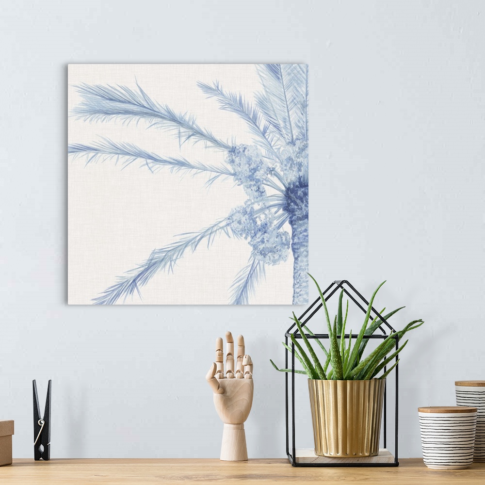 A bohemian room featuring A blue palm split between two panels against a white background.