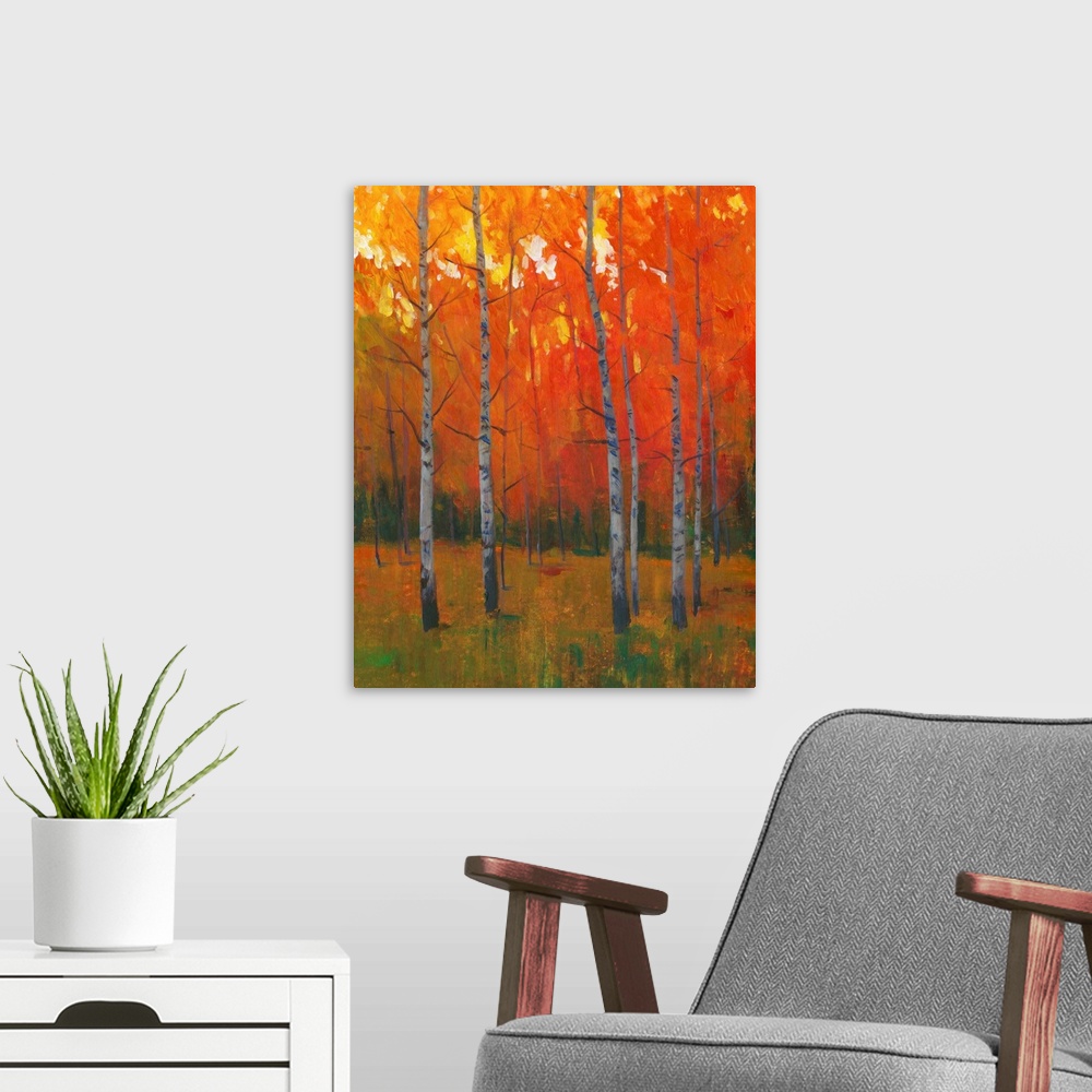 A modern room featuring Contemporary painting of a forest of thin trees with leaves glowing in the sunset light in the fall.