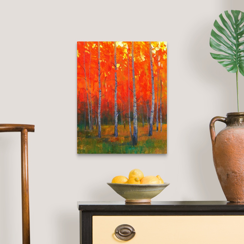 A traditional room featuring Contemporary painting of a forest of thin trees with leaves glowing in the sunset light in the fall.