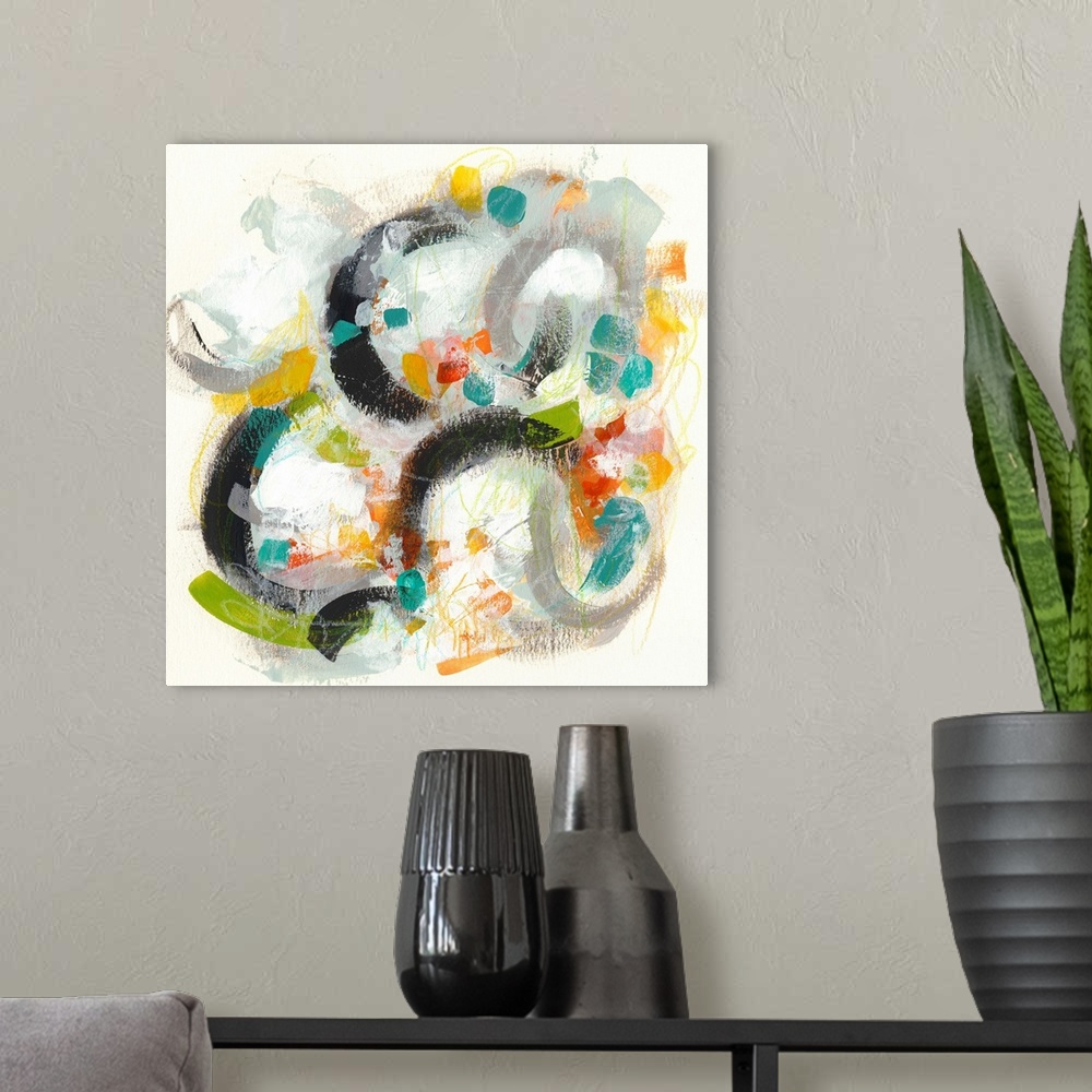A modern room featuring Contemporary abstract painting using vibrant colors and circular shapes.