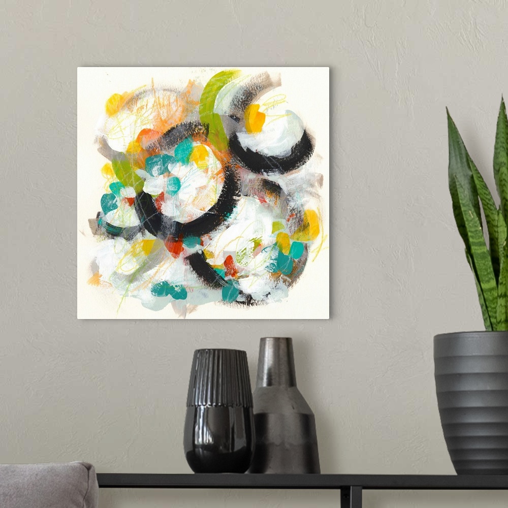 A modern room featuring Contemporary abstract painting using vibrant colors and circular shapes.
