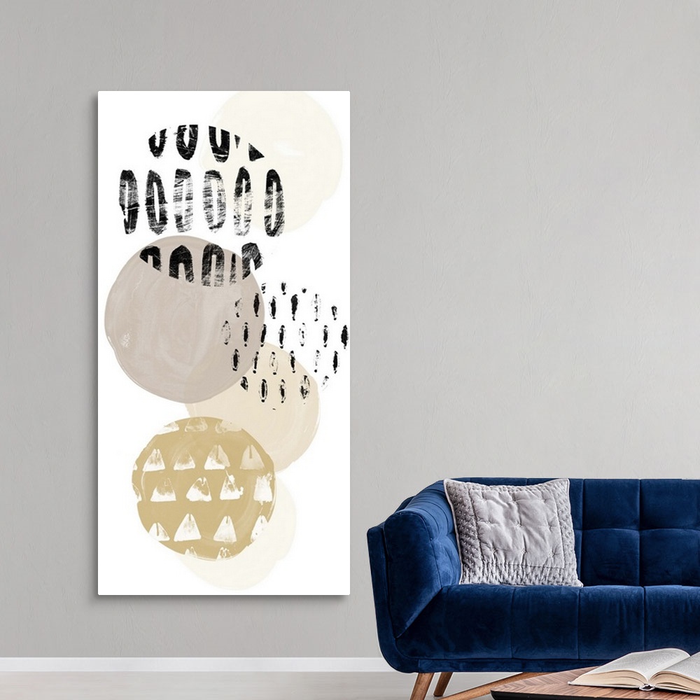 A modern room featuring Abstract painting of circular patterned shapes in black, grey, and gold on white.