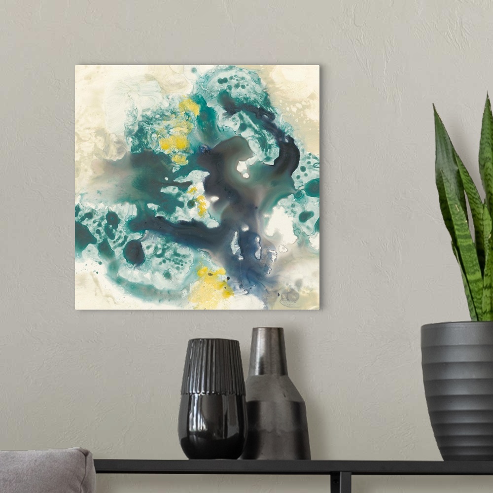 A modern room featuring Abstract artwork of fluid paint in shades of green, blue and yellow glide against a khaki color o...