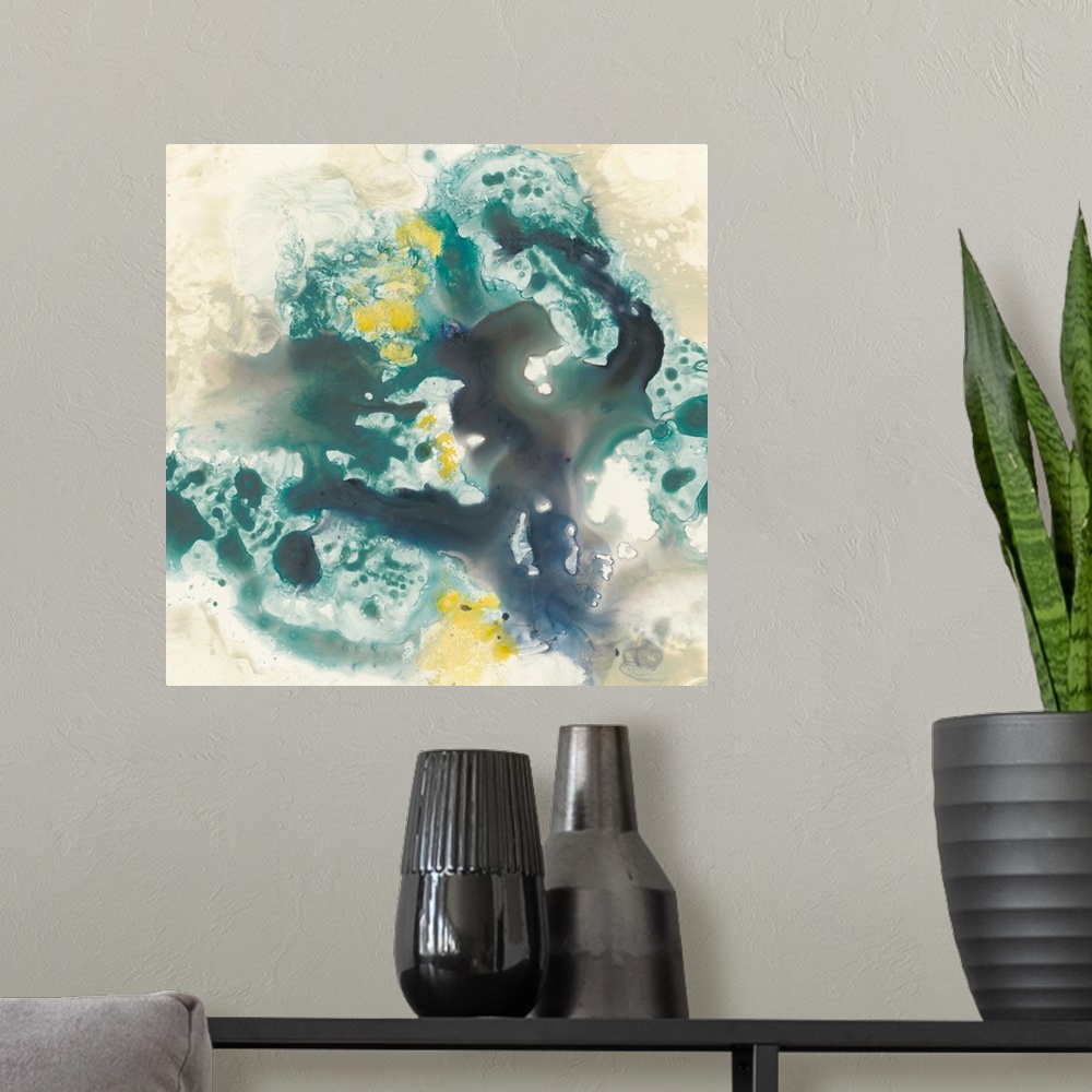A modern room featuring Abstract artwork of fluid paint in shades of green, blue and yellow glide against a khaki color o...
