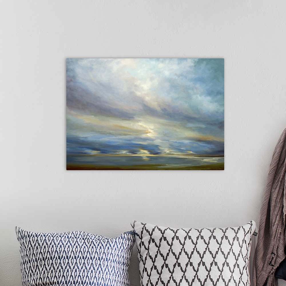 A bohemian room featuring Contemporary seascape painting of sunlight shining though clouds over the ocean.