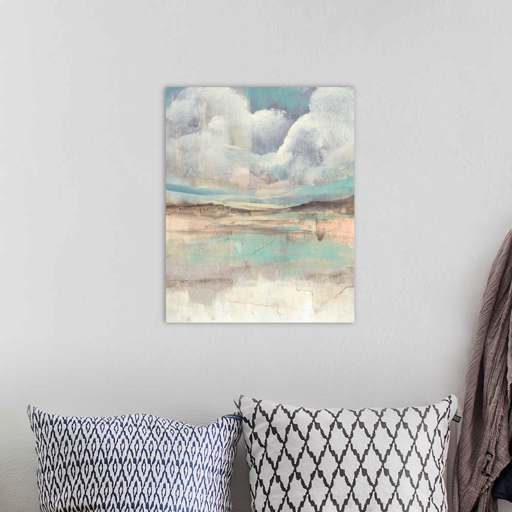 A bohemian room featuring Contemporary abstract with clouds hovering over a multi-colored landscape.