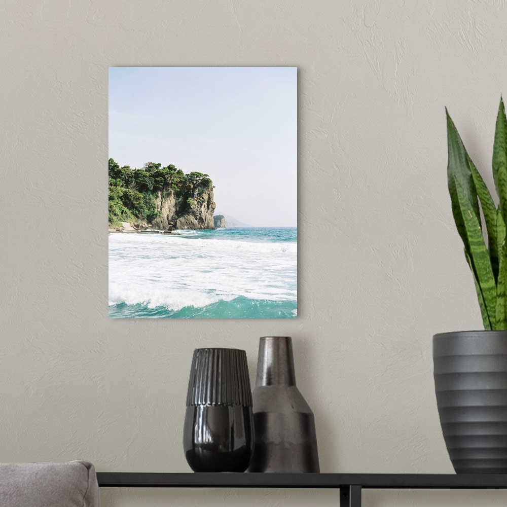 A modern room featuring Photograph of tall tree-topped cliffs above the ocean.