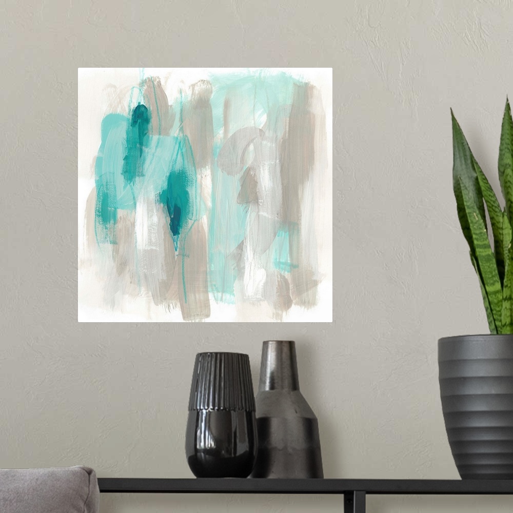 A modern room featuring Grey and aqua toned abstract artwork with broad brushstrokes.
