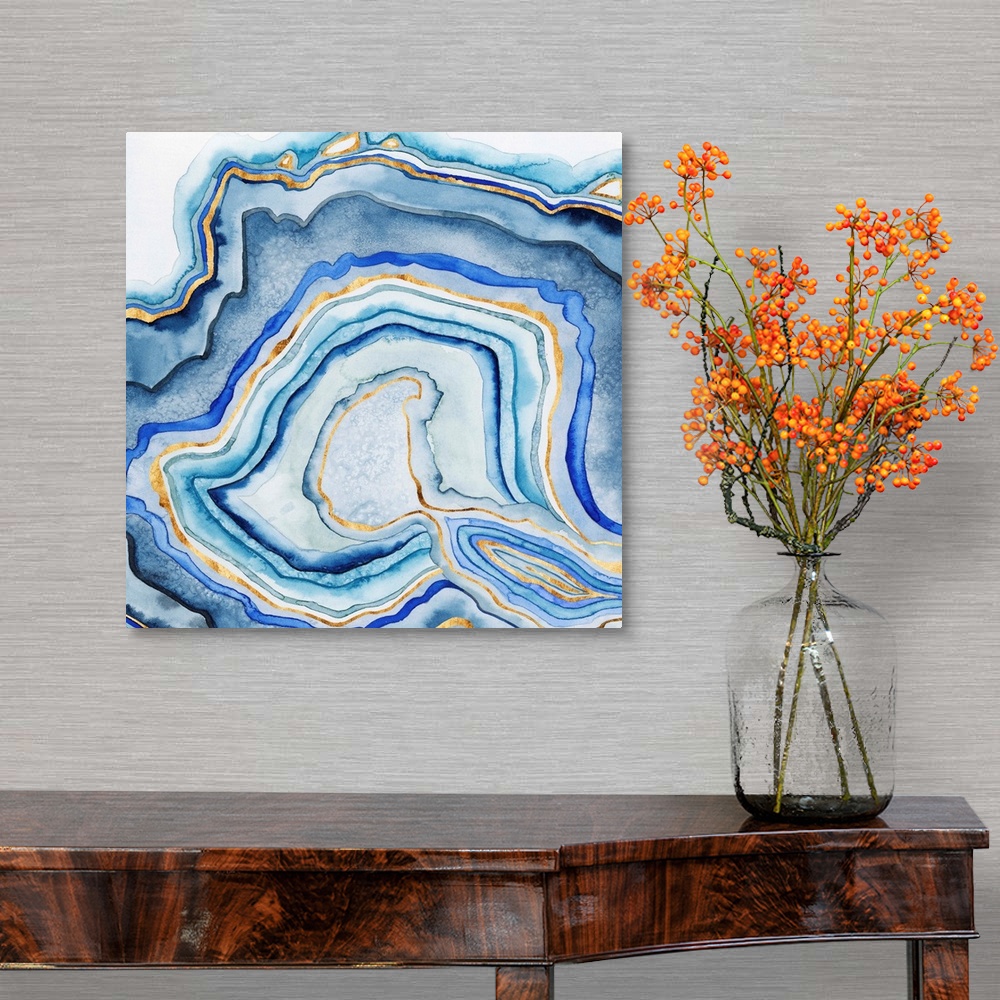 A traditional room featuring Abstract artwork in blue and gold layers resembling a cross section of an agate stone.