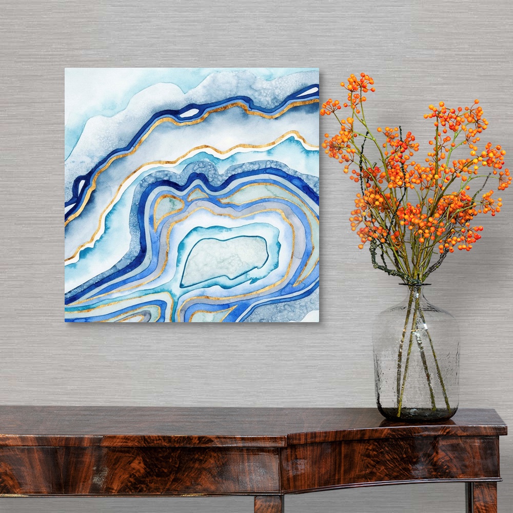 A traditional room featuring Abstract artwork in blue and gold layers resembling a cross section of an agate stone.