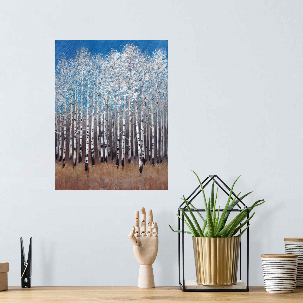 A bohemian room featuring Contemporary painting of a forest of white birch trees under a blue sky.
