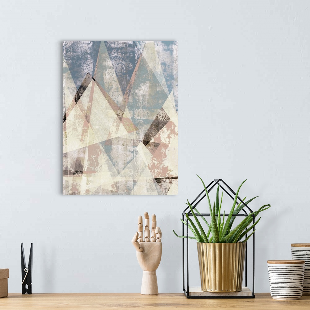 A bohemian room featuring Abstract artwork of triangular shapes with a weathered texture.