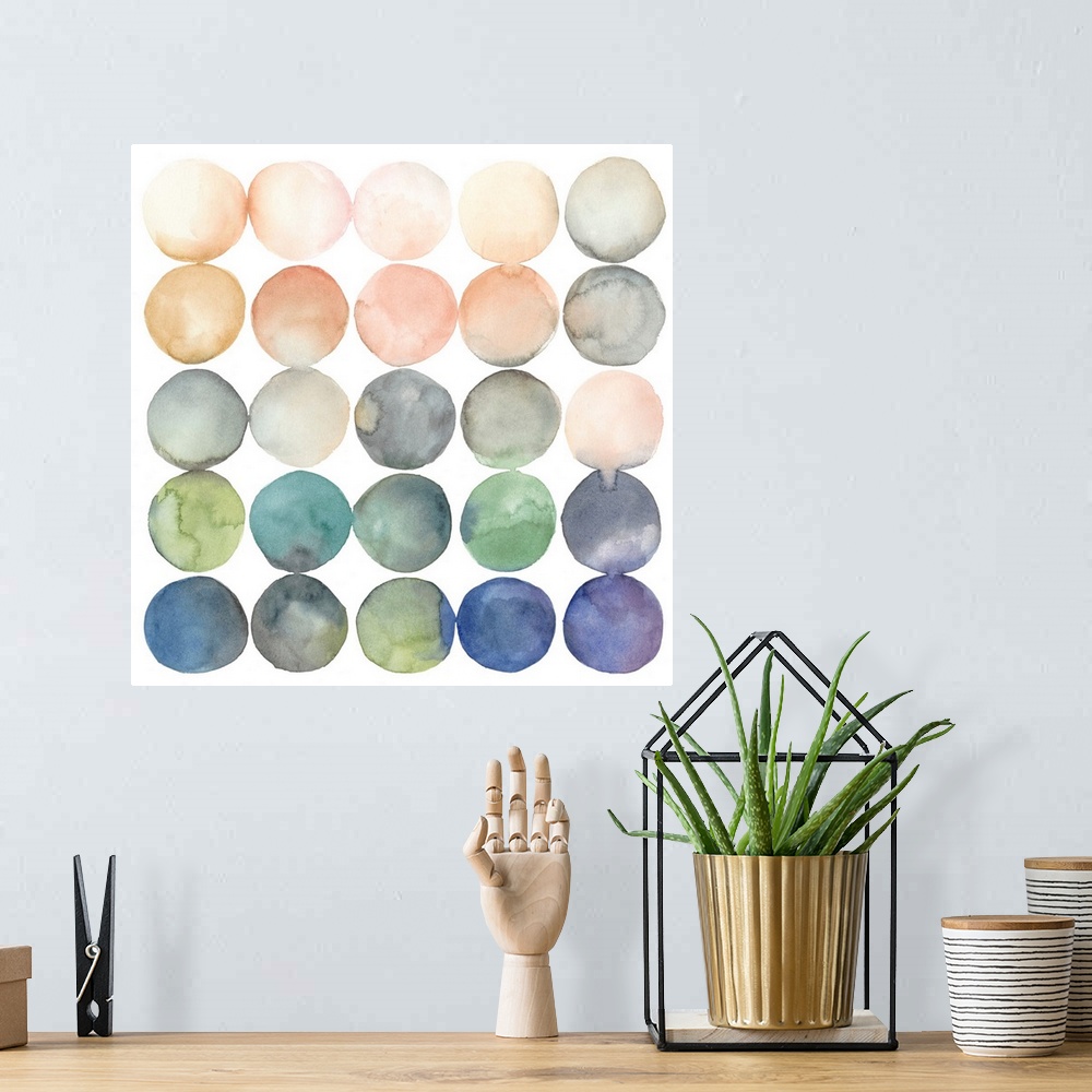 A bohemian room featuring Watercolor art print of twenty-five round shapes in peach and blue shades.