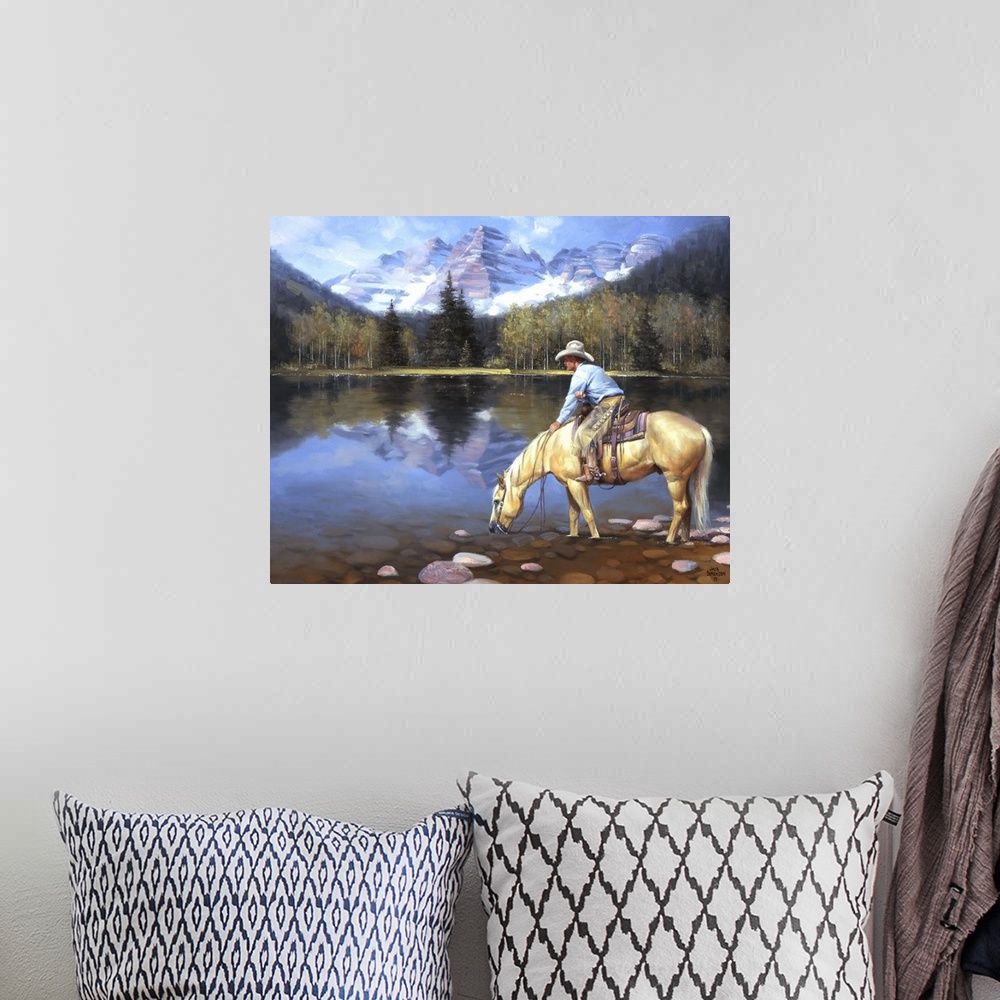 A bohemian room featuring Contemporary Western artwork of a cowboy on his horse taking a drink from a mountain lake.