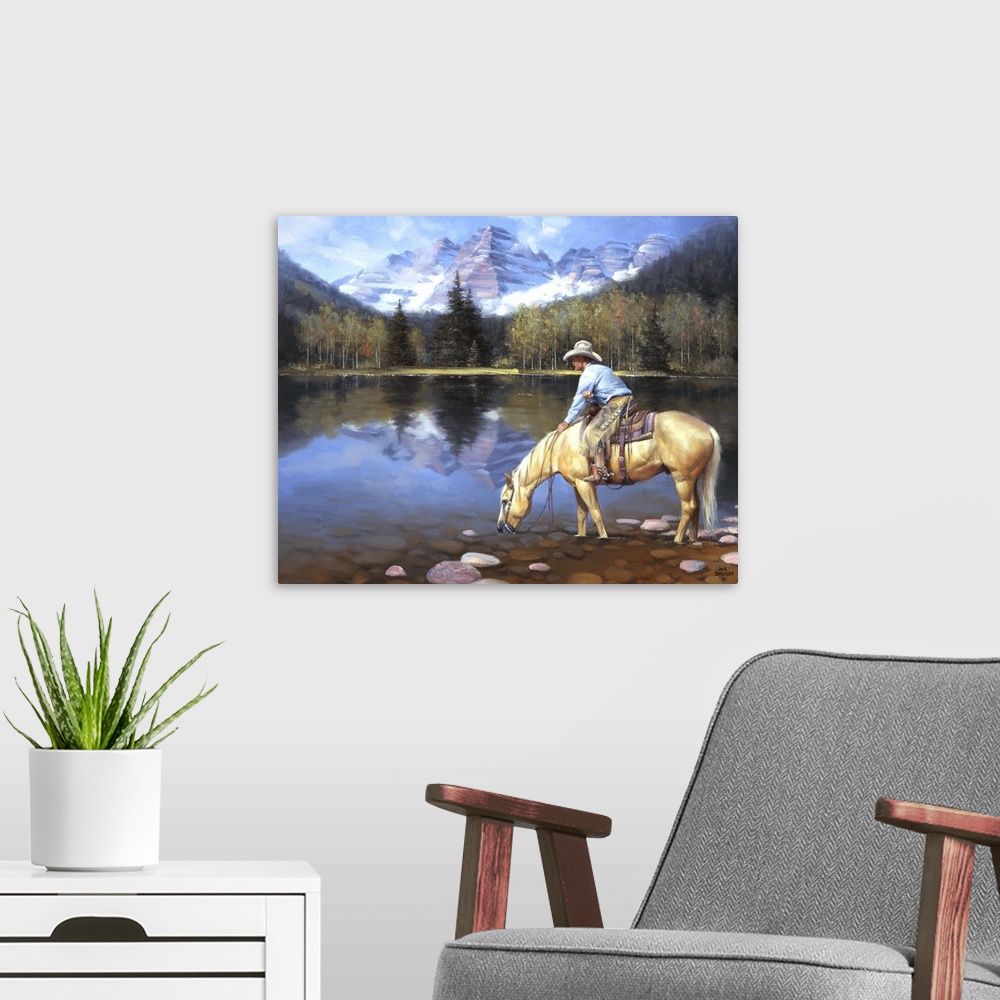 A modern room featuring Contemporary Western artwork of a cowboy on his horse taking a drink from a mountain lake.
