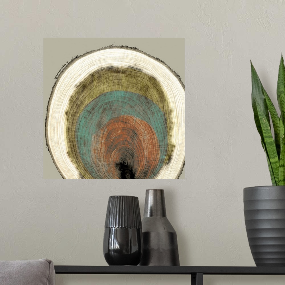 A modern room featuring Abstract artwork of a multi-colored cross-section of a tree trunk.