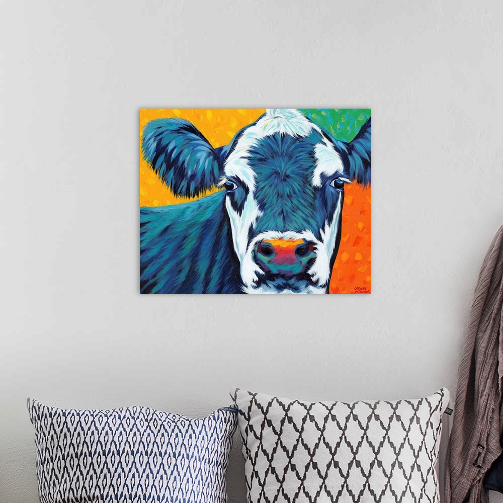 A bohemian room featuring Colorful contemporary painting of a portrait of a cow.