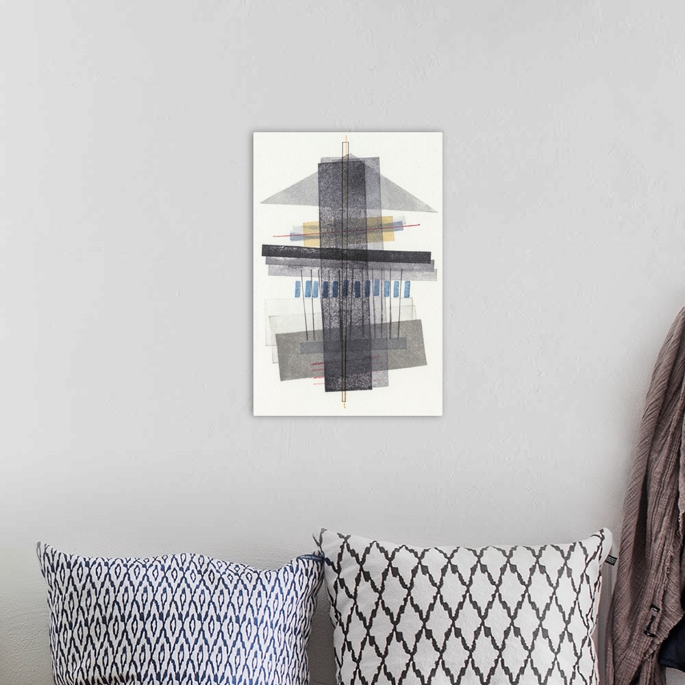 A bohemian room featuring Mid century style abstract geometric artwork of dark grey shapes on white.