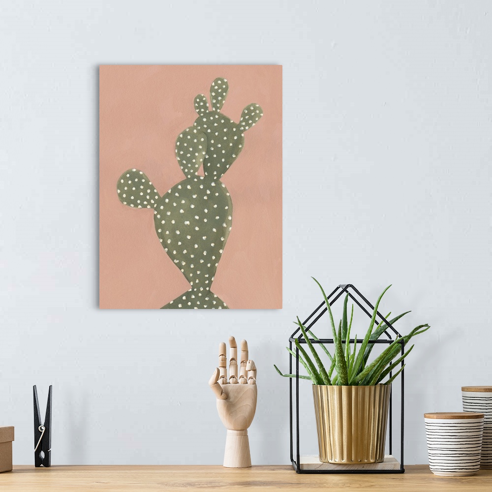 A bohemian room featuring Contemporary painting of a cactus on a coral colored background.