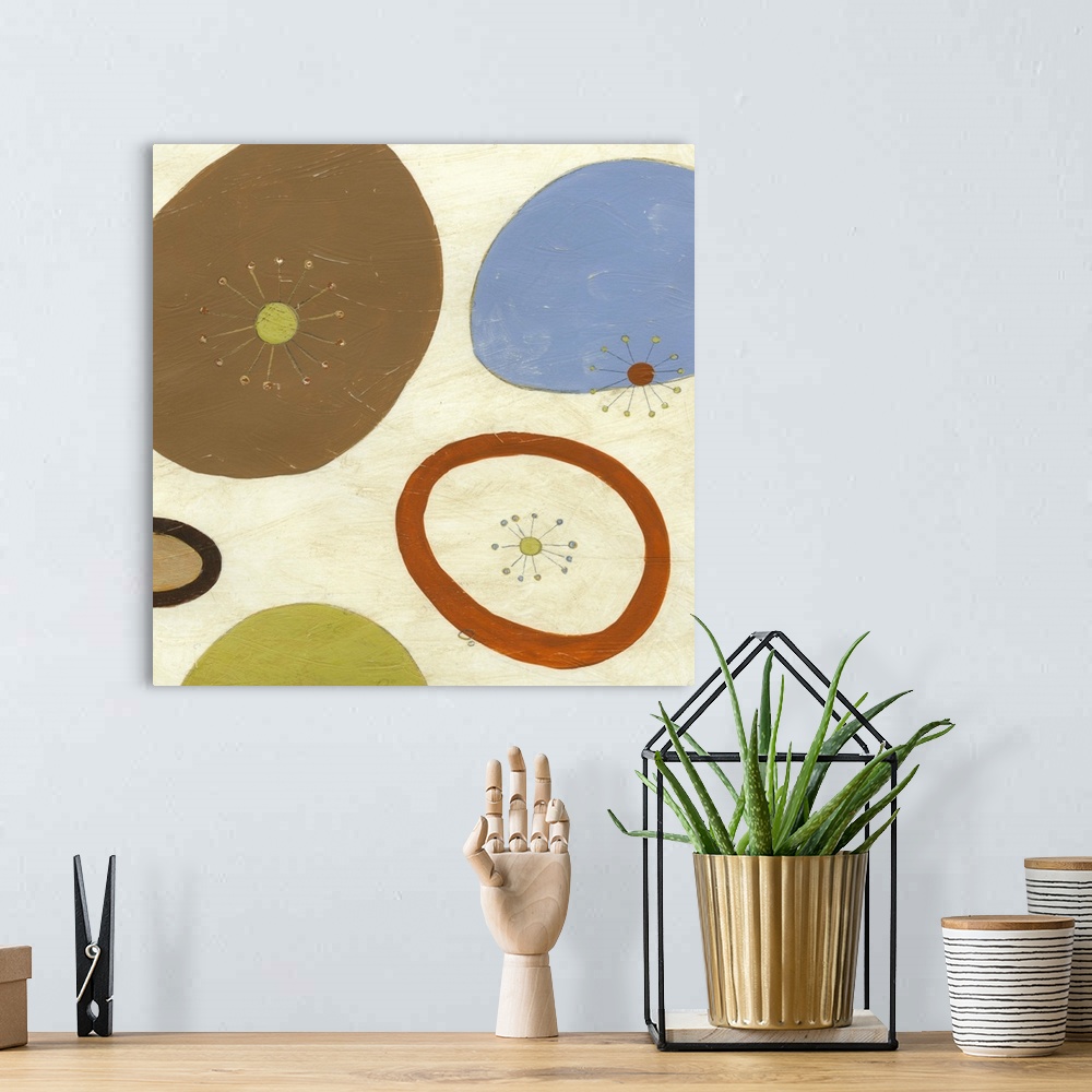 A bohemian room featuring Contemporary retro inspired abstract painting of organic shapes against a cream toned background.