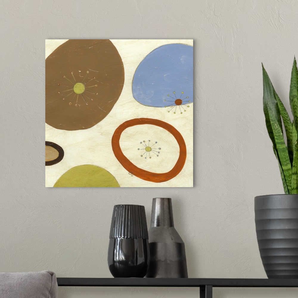 A modern room featuring Contemporary retro inspired abstract painting of organic shapes against a cream toned background.