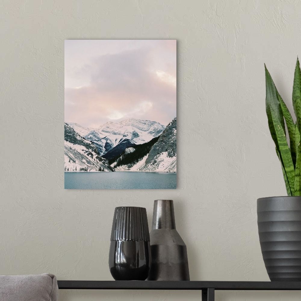 A modern room featuring Photograph of snow covered mountains under a pink tinged sky
