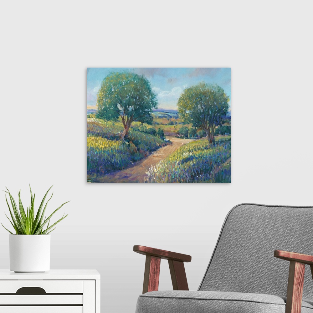 A modern room featuring Contemporary landscape painting of trees along a dirt path in the countryside.