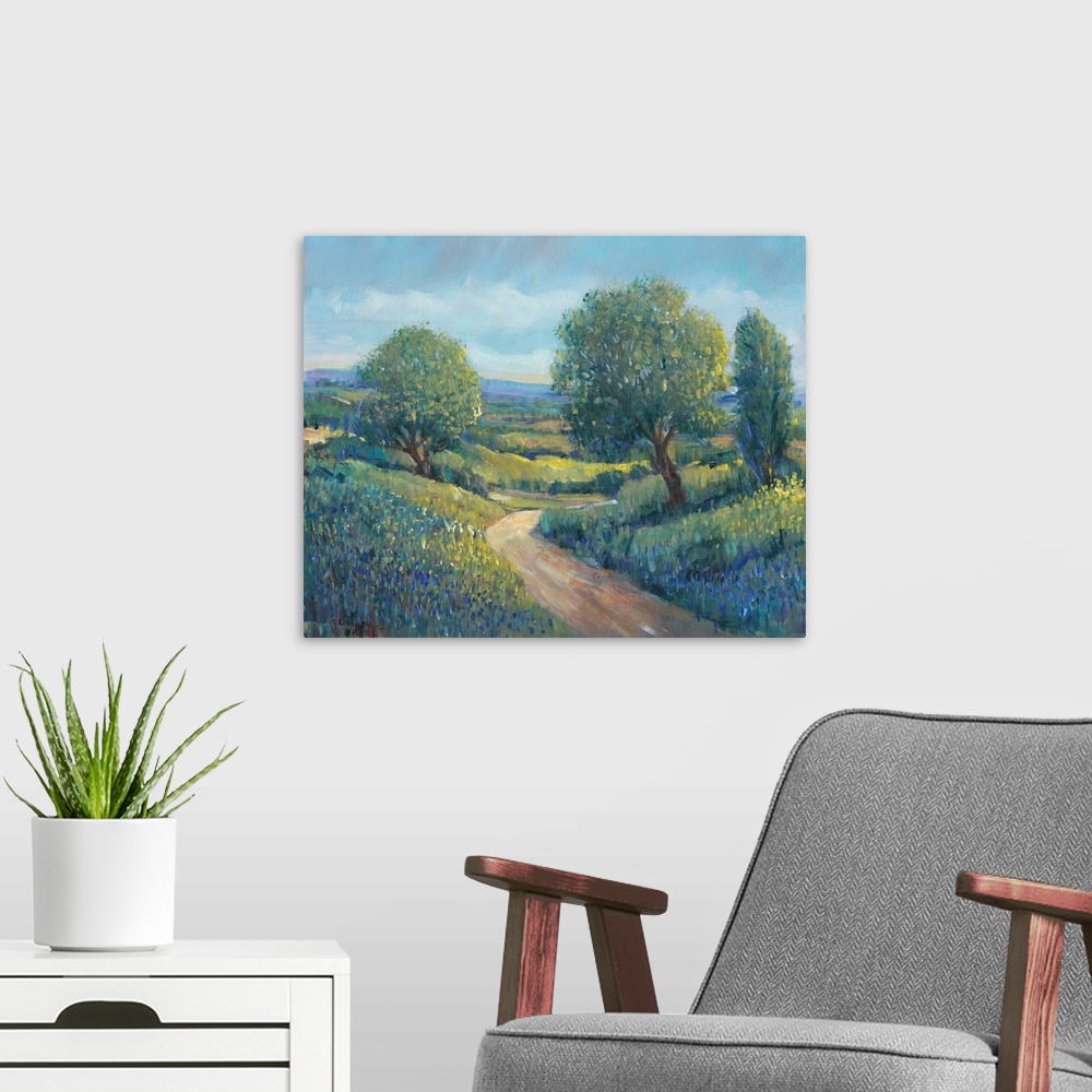 A modern room featuring Contemporary landscape painting of trees along a dirt path in the countryside.