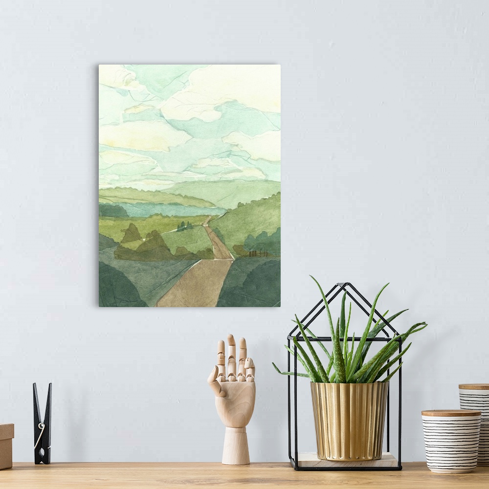 A bohemian room featuring Countryside landscape painting with a road crossing over rolling hills.