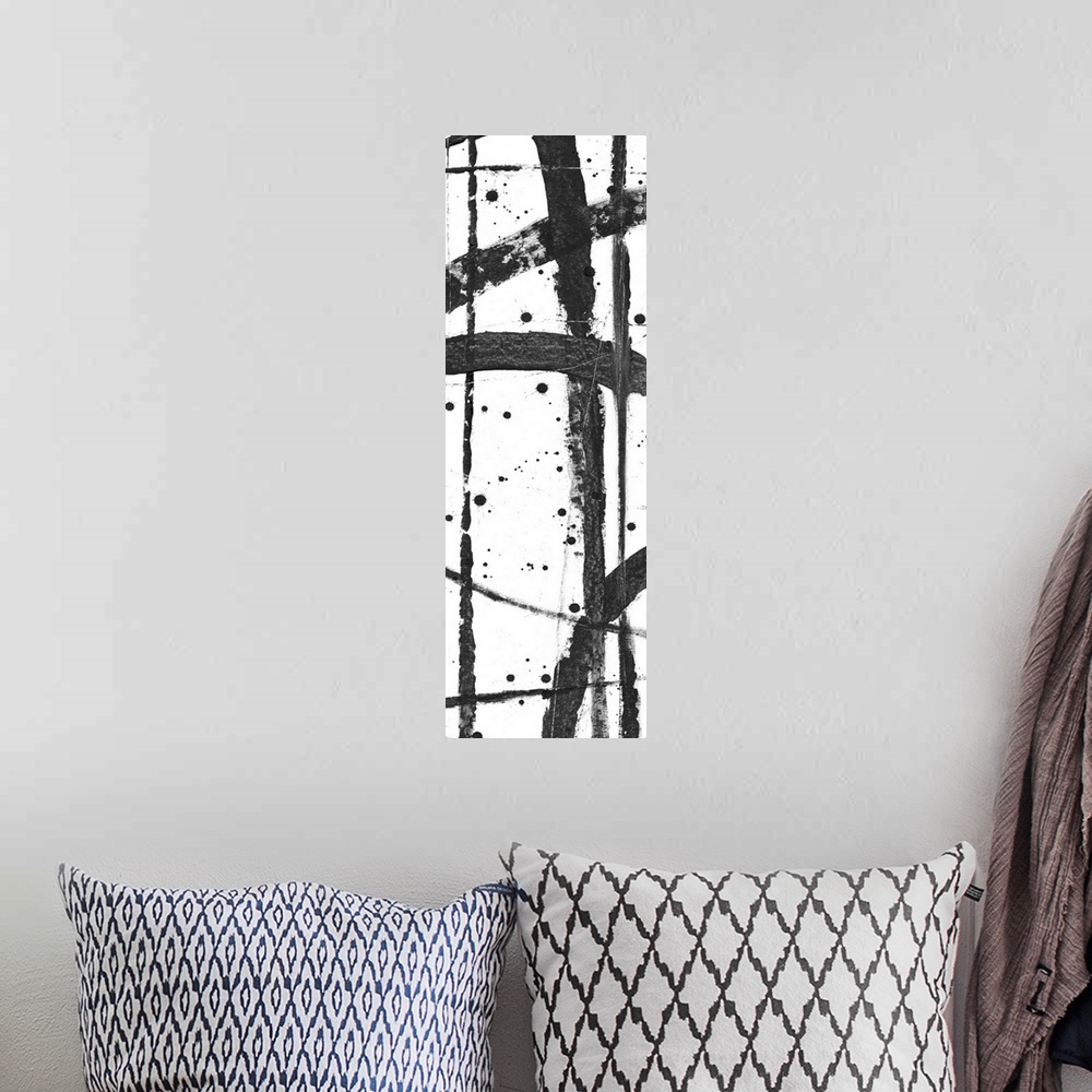 A bohemian room featuring Contemporary abstract painting with criss-crossing black lines on a white background.